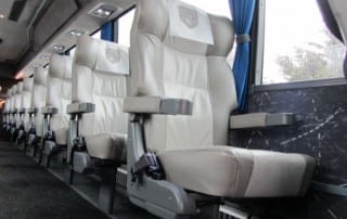 Comfortable bus seats in neat rows.